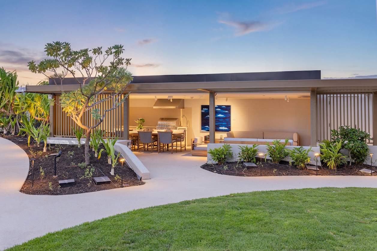 A modern house with a patio and a garden.